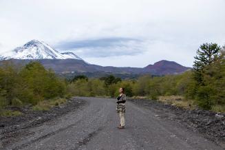 Photo of Camila Jara Quilapan, with the iconic Llaima Volcano in the background.