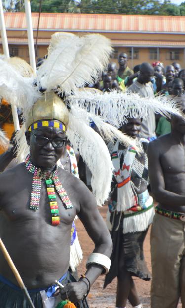 Man of the Ketebo tribe with traditional attire leading the dance in Torit