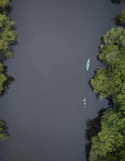 two kayaks on a river seen from above 