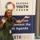 Lawyer and SDG4Youth Network advocate Cynthia Nyongesa posing with the ECOSOC banner
