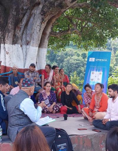 participating young journalists interacting with the community members during an open discussion on climate related issues in their locality. 