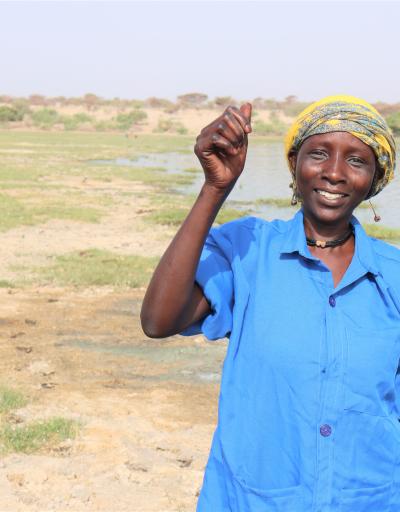Woman is saluting the camera in Artomossi, Chad