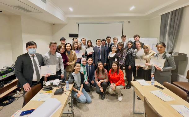 A youth group is seen holding their diplomas after having participated on a two-day training programme, based on UNESCO’s tools on youth engagement in Tashkent