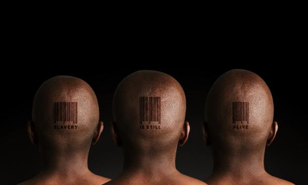 Three men with barcode tattoos on black background.